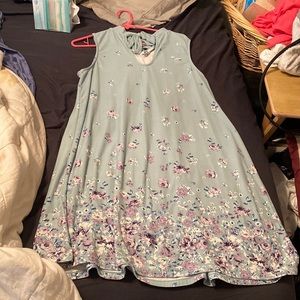 Jade green colored dress with lilac purple flowers on it
